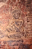 Prasat Kravan - bas reliefs on the brickwork, figure in prayer.